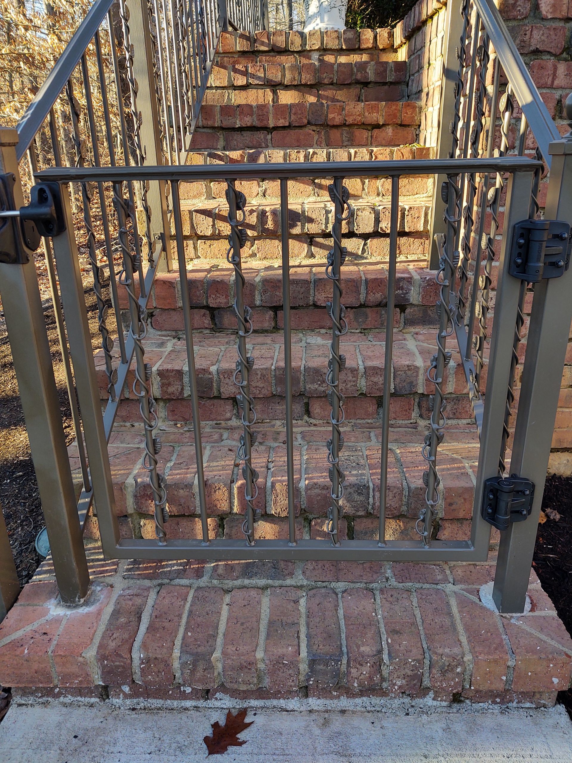 a metal gate leading to a set of stairs