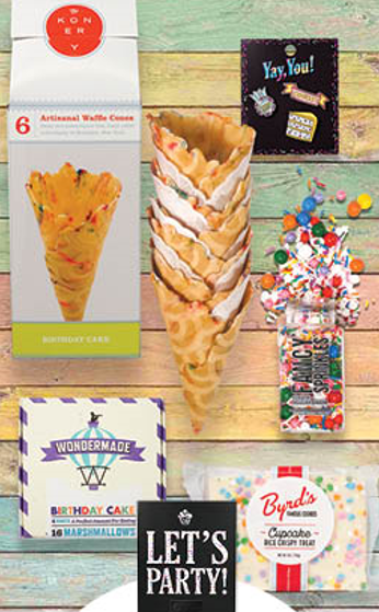 A stack of waffle cones with sprinkles and a sign that says let 's party