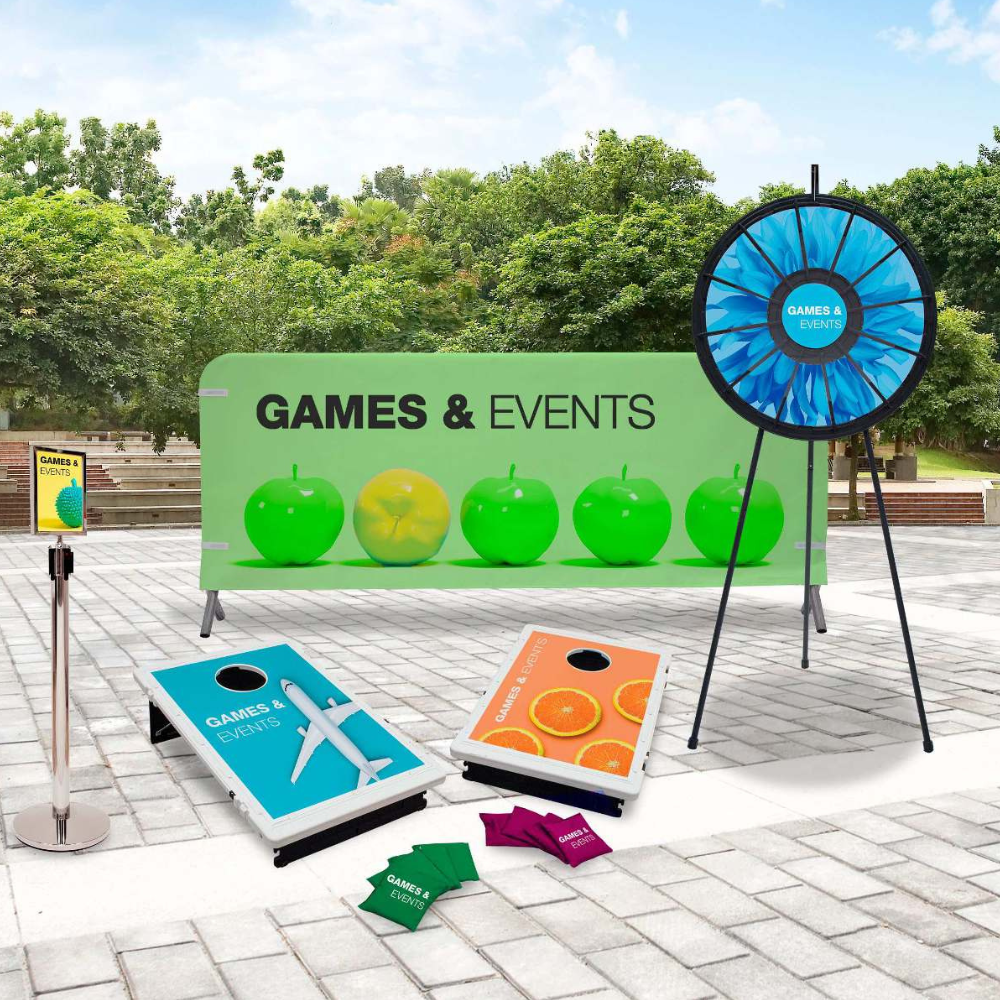 A bunch of games and events are sitting on a brick sidewalk.