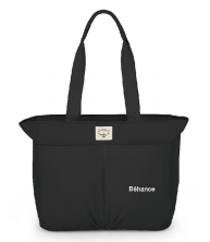 A black tote bag with the word behance on it