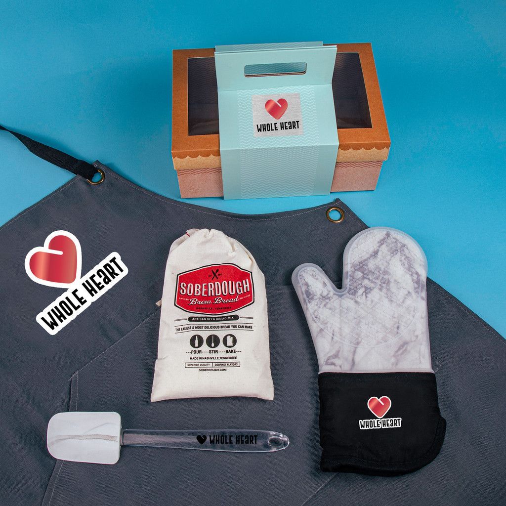 An apron with a heart and the word whole heart on it