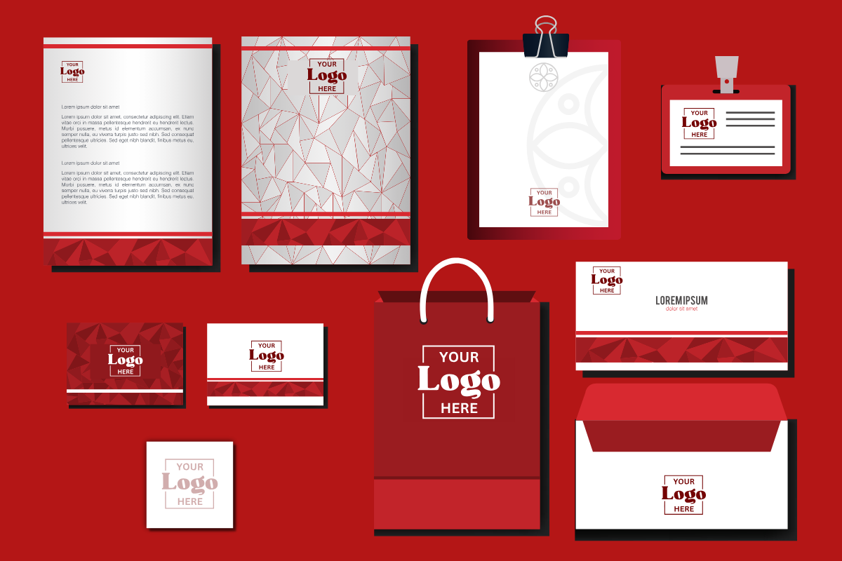 A set of business cards , envelopes , a bag and a clipboard on a red background.