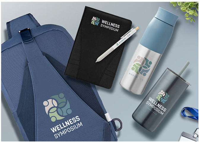 Flat lay image of branded wellness products including a sling backpack, notebook, pen, reusable wate