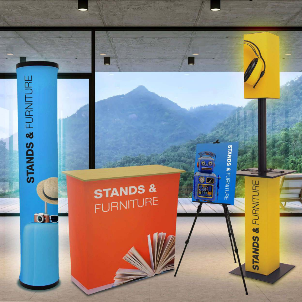 A display of stands and furniture in a room with mountains in the background