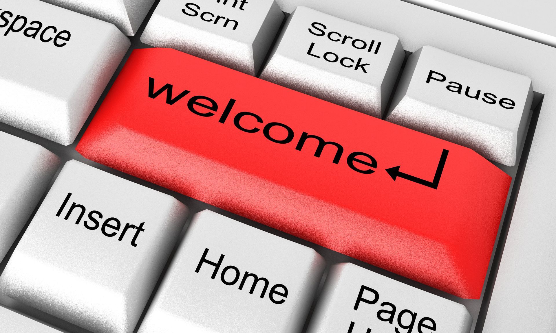 A computer keyboard with a red welcome key