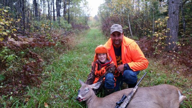 Father and kid with their hunt
