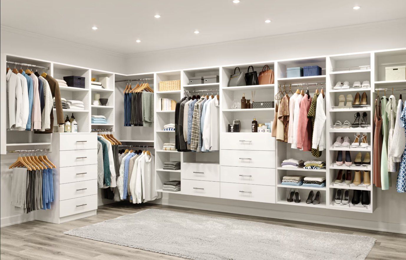 A walk in closet filled with lots of clothes and shoes.