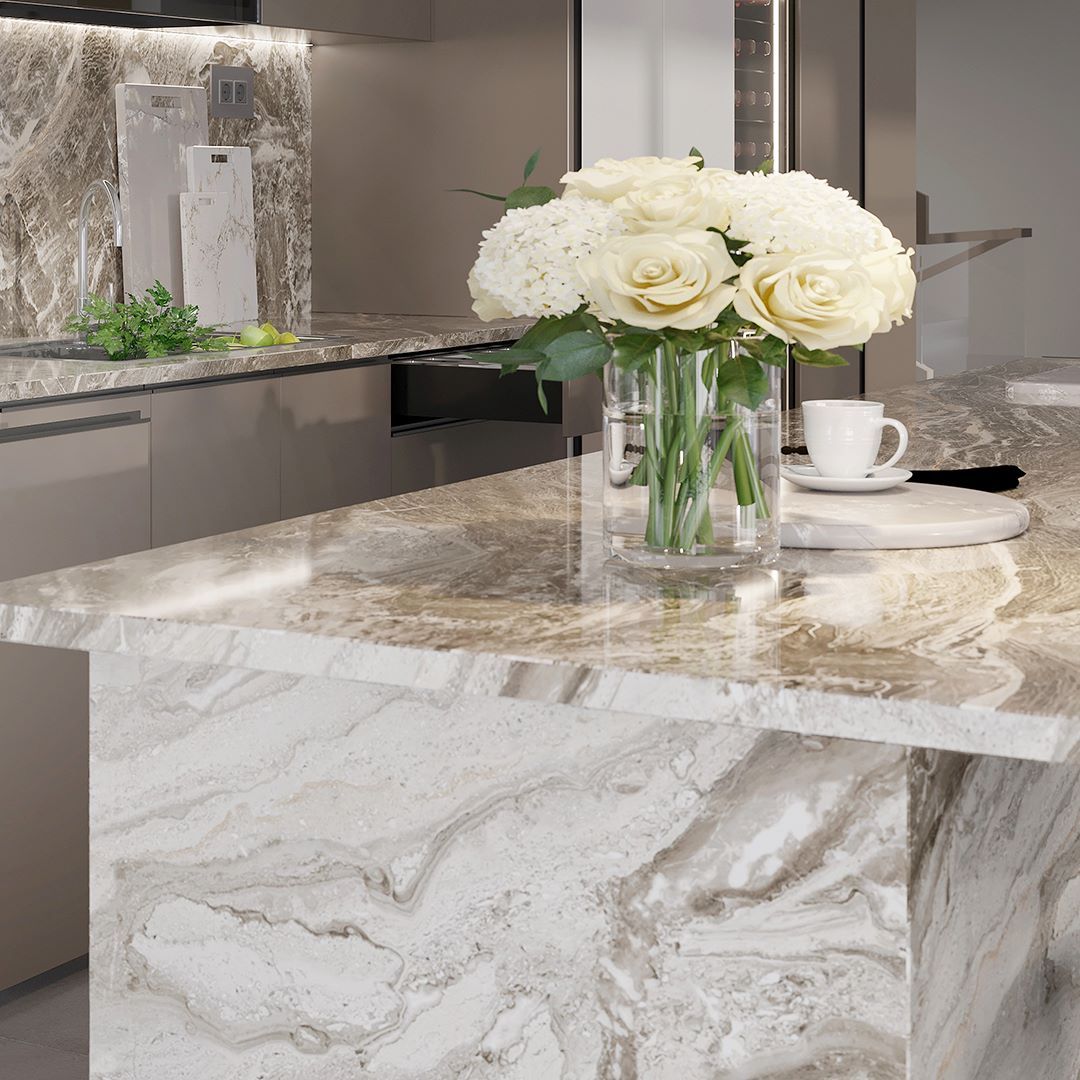 A kitchen counter with a vase of flowers on it