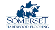 Somerset Hardwood Flooring logo: white horse silhouette inside a dark blue leaf, below the word