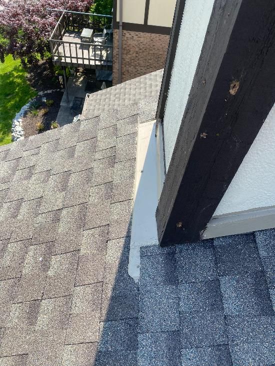 A close up of a roof with a gutter on it.
