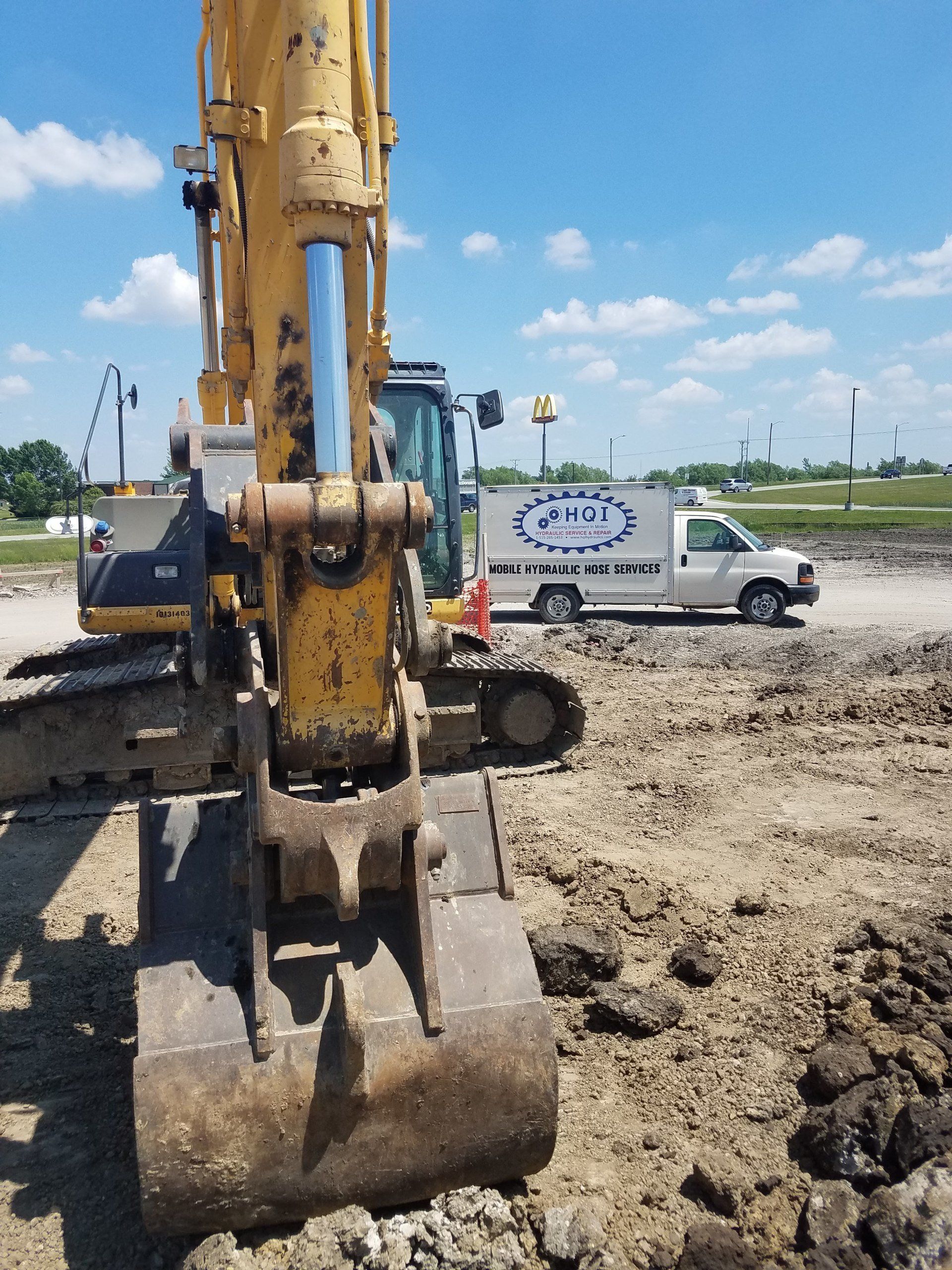 Excavator w/ the HQI service van