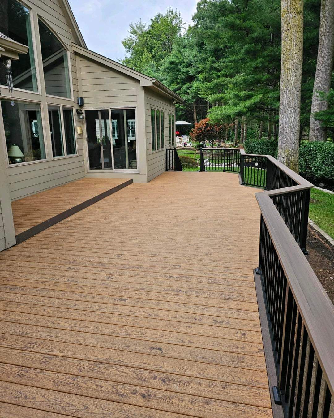 A wooden deck with a railings
