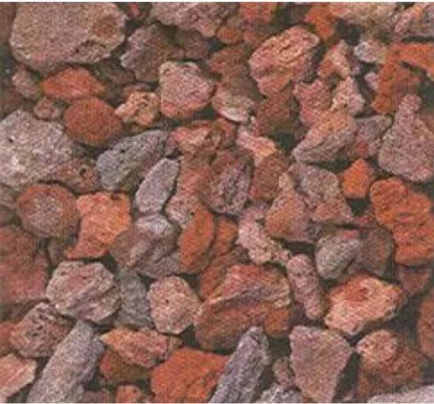 Close-up of small reddish-brown gravel stones covering the ground