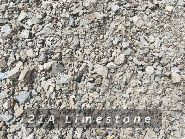 Close-up of gray limestone gravel with label “2-A Limestone” along the bottom.