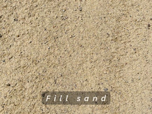 Textured tan fill sand with a small label reading “Fill sand”