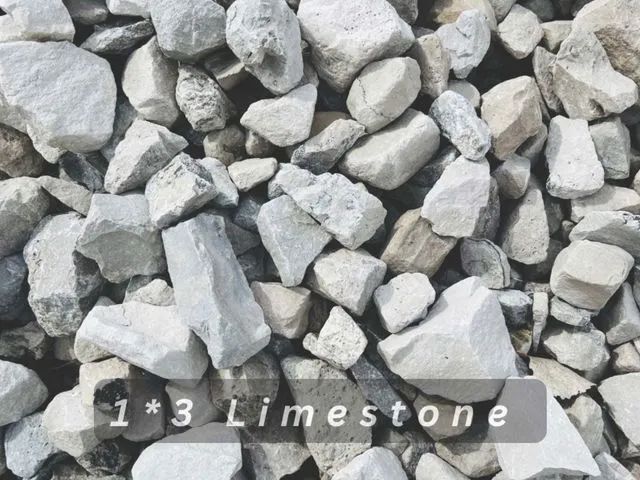 Pile of white limestone rocks with label “1*3 Limestone”