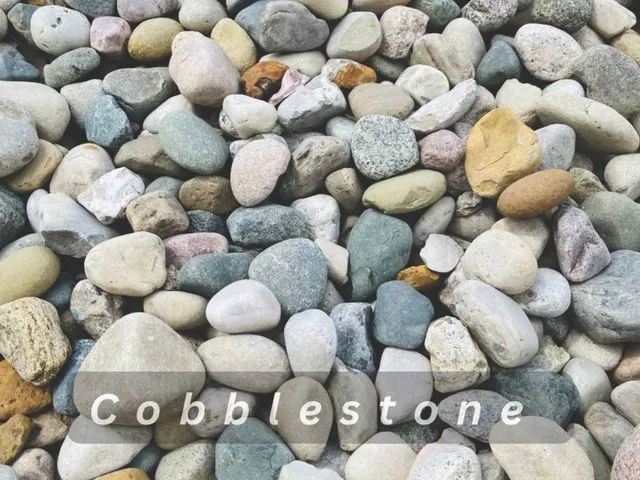 Close-up of multicolored smooth cobblestones filling the frame