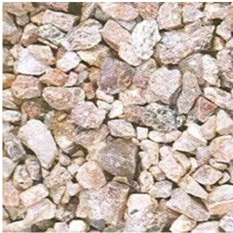 Close-up of light tan and white gravel stones filling the frame