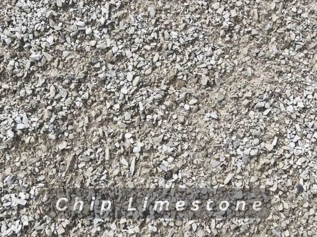 Gray crushed limestone gravel texture with small white stones and faint 