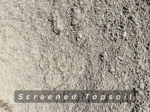Pile of light tan screened topsoil with a grainy texture