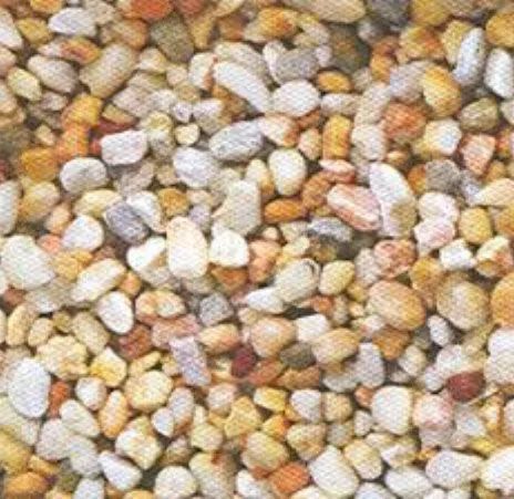Close-up of mixed small pebbles in beige, white, gray, and tan tones