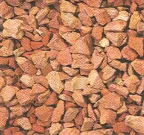 Pile of small reddish-brown rocks filling the frame