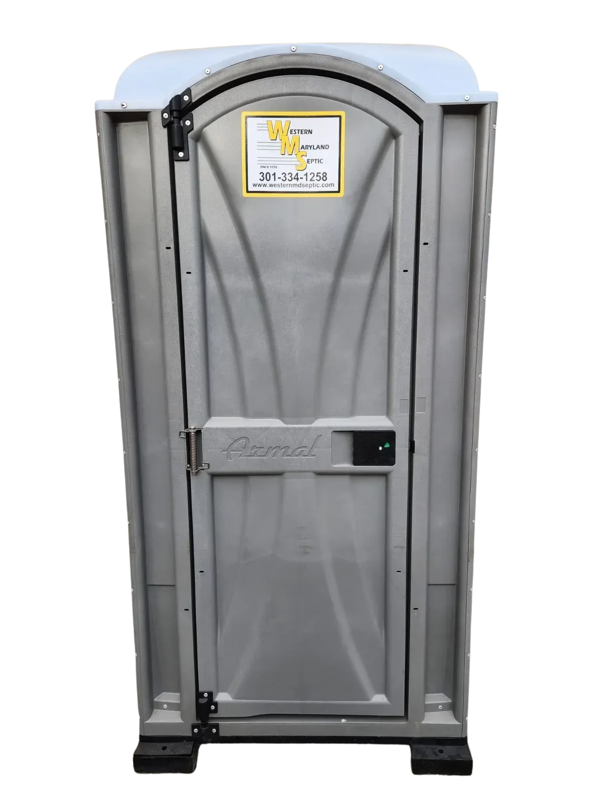 Gray portable toilet with a small warning sign on the door and a blue sky background