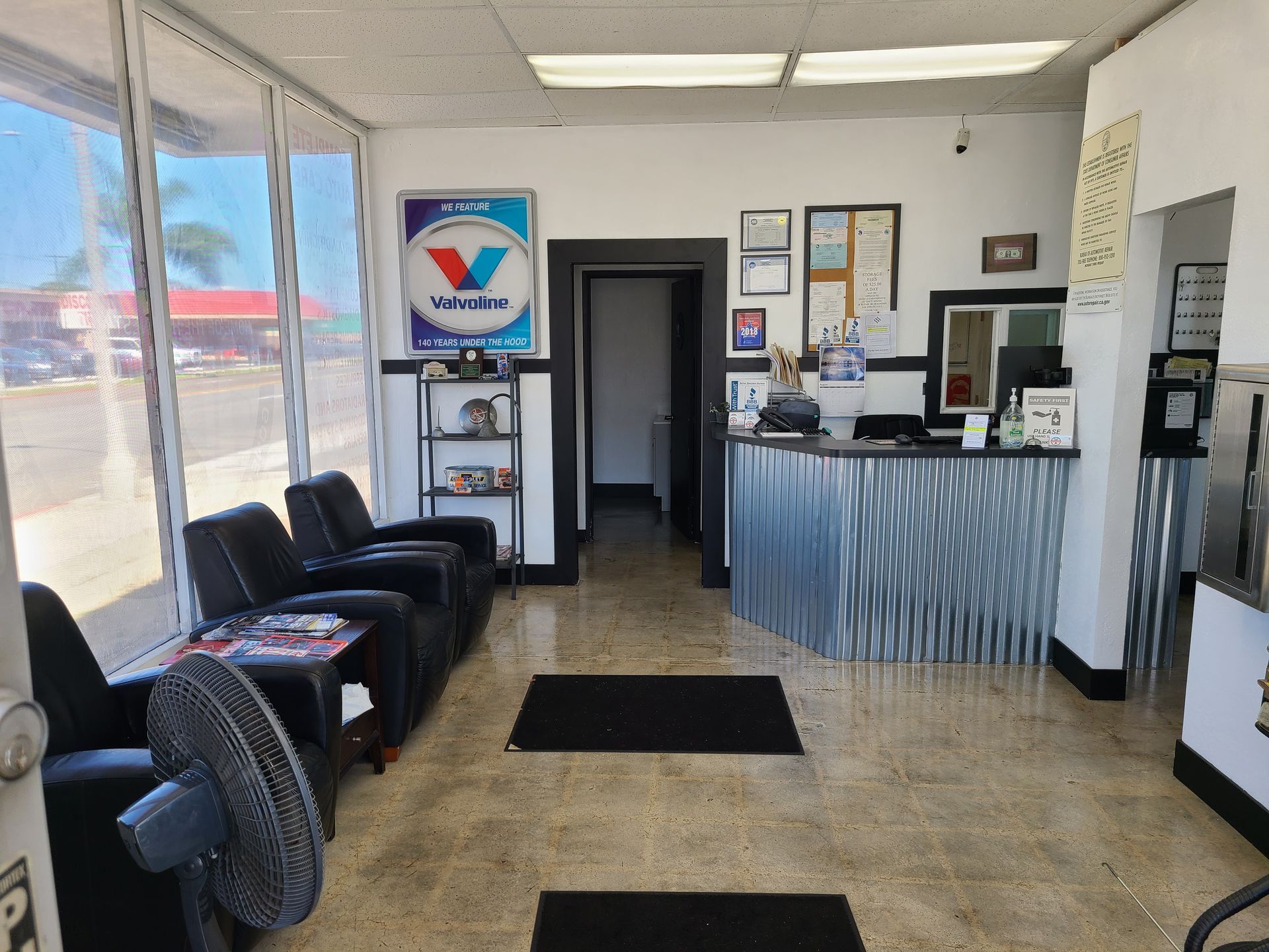 A waiting room with a sign that says valvoline on it
