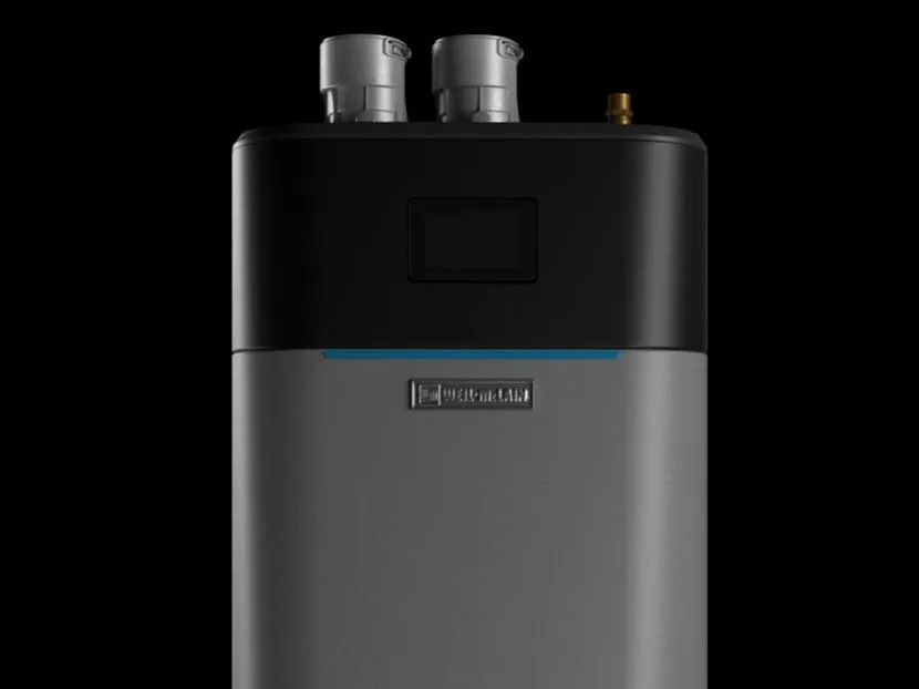 Compact black and silver appliance with two silver vents on top and a small display panel.