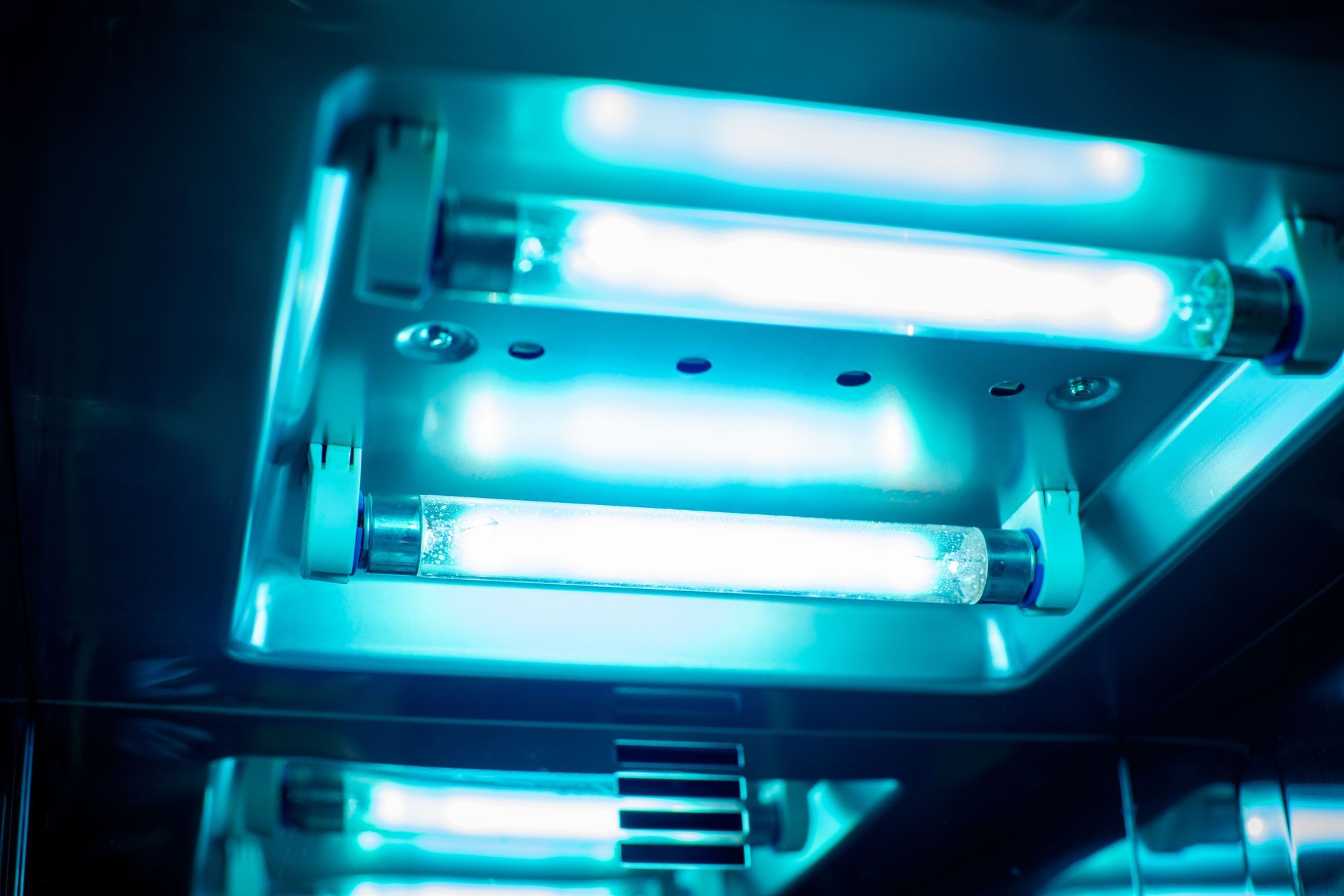 Blue ultraviolet lights in a metallic sterilization chamber