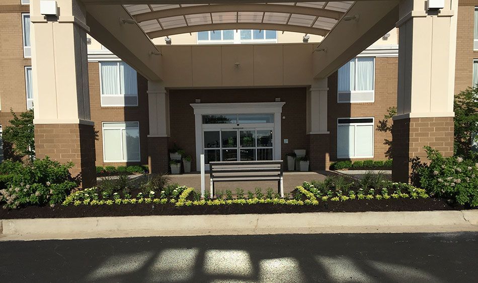 The entrance to a hotel with a canopy over it.