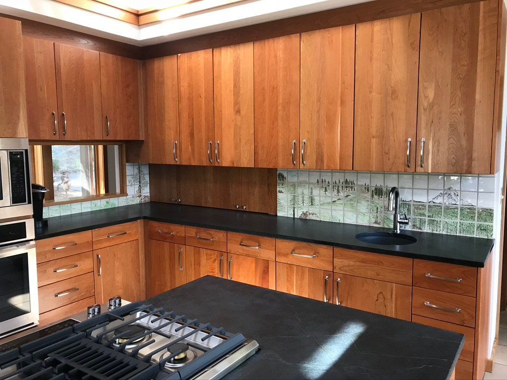 Modern kitchen with wooden cabinets, black countertops, and a gas stove in the foreground