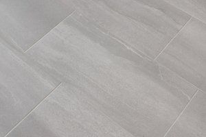 Light gray tiled floor with diagonal grout lines and subtle texture