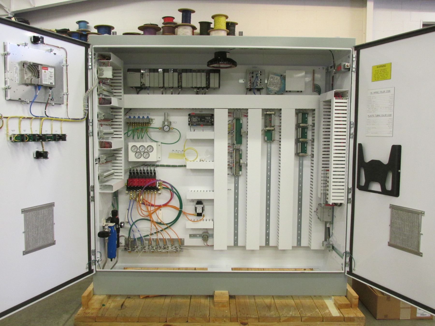 A large white box with a lot of wires inside of it