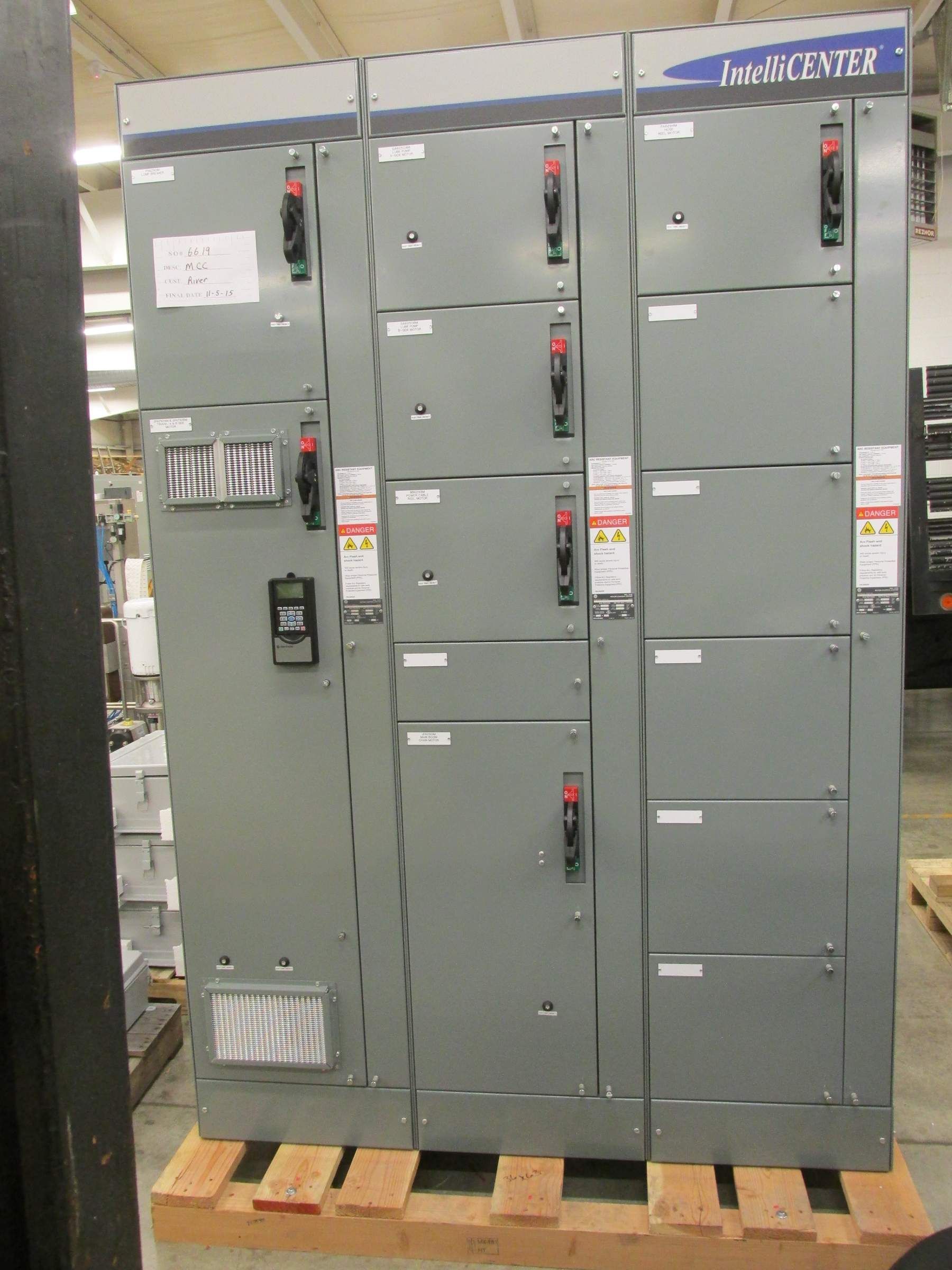 A large electrical panel is sitting on a wooden pallet