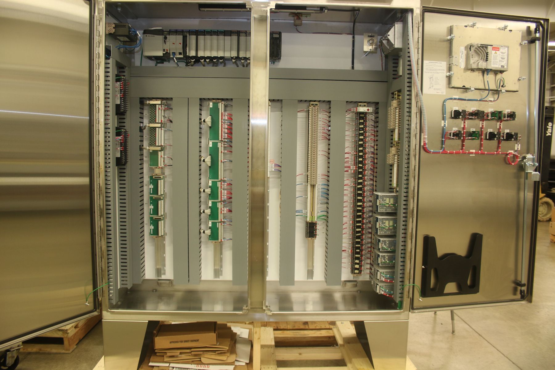 The inside of a stainless steel cabinet with the doors open