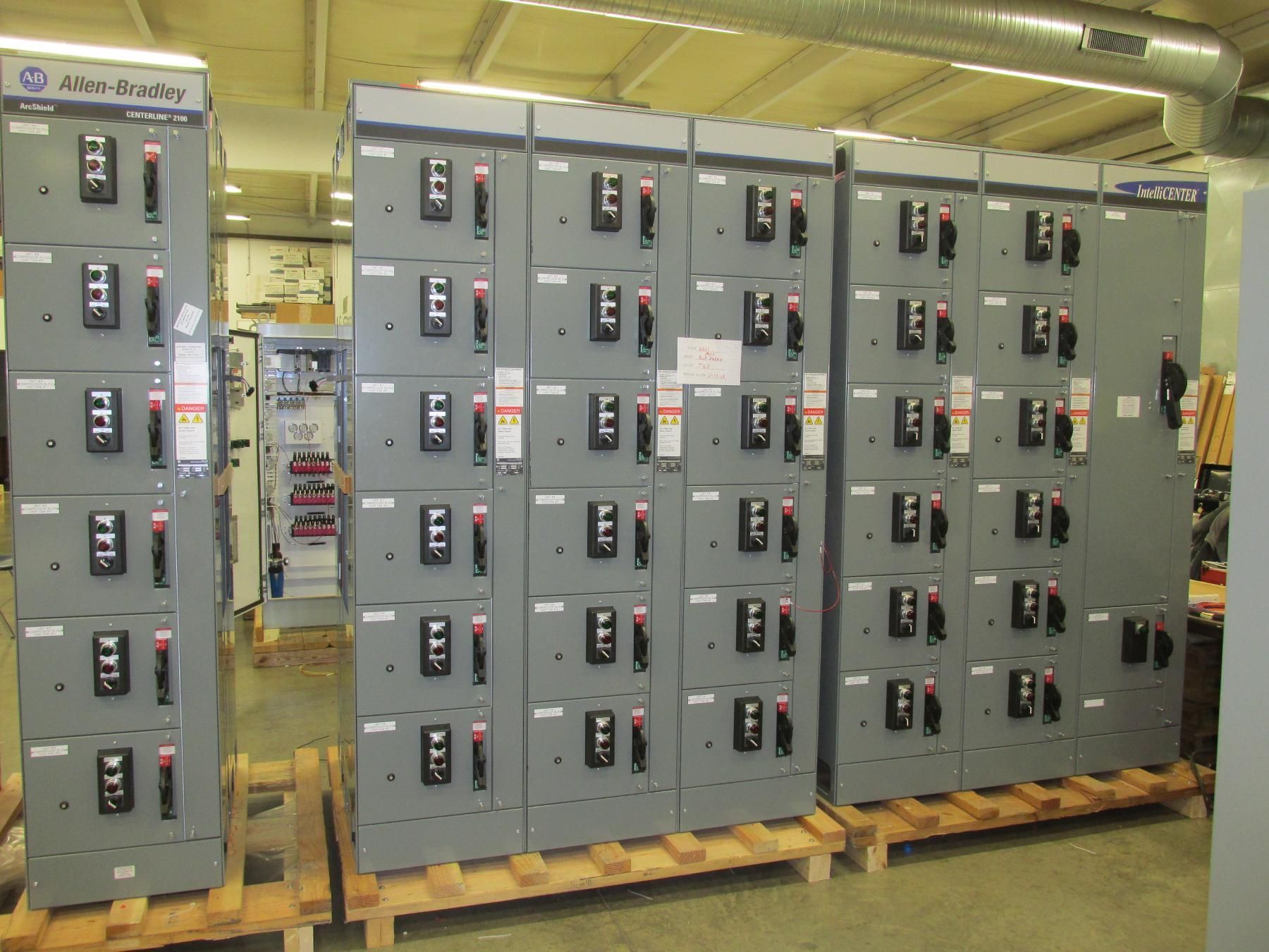 A bunch of electrical panels are stacked on top of each other