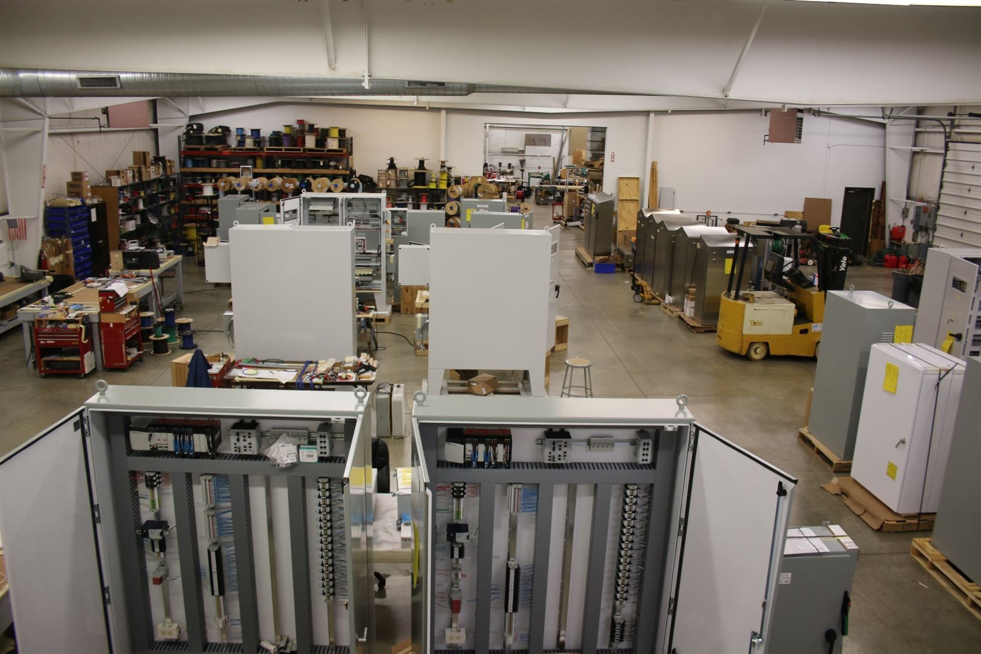 A large warehouse filled with lots of electrical equipment