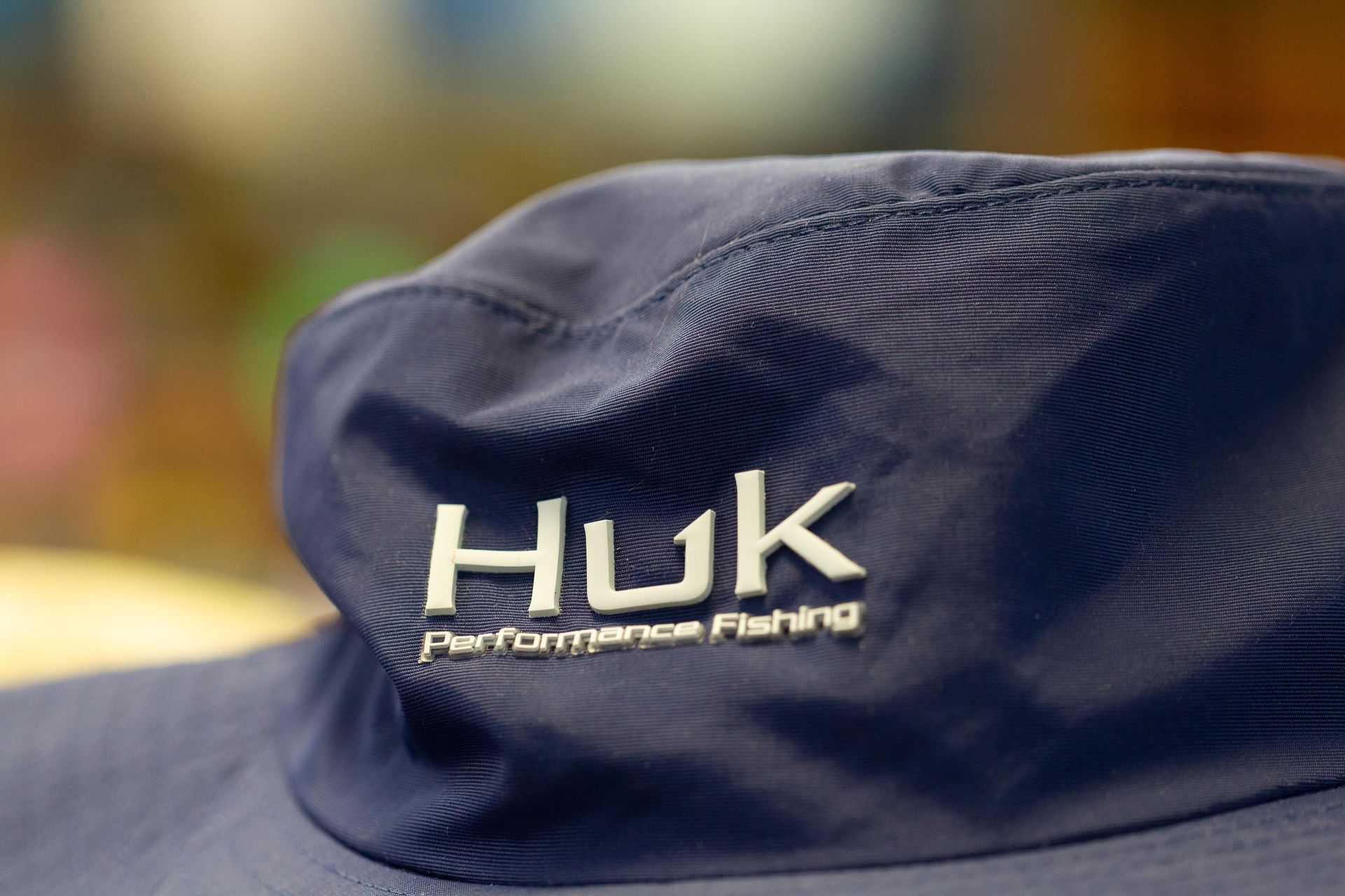 Navy blue Huk hat with the brand's logo 