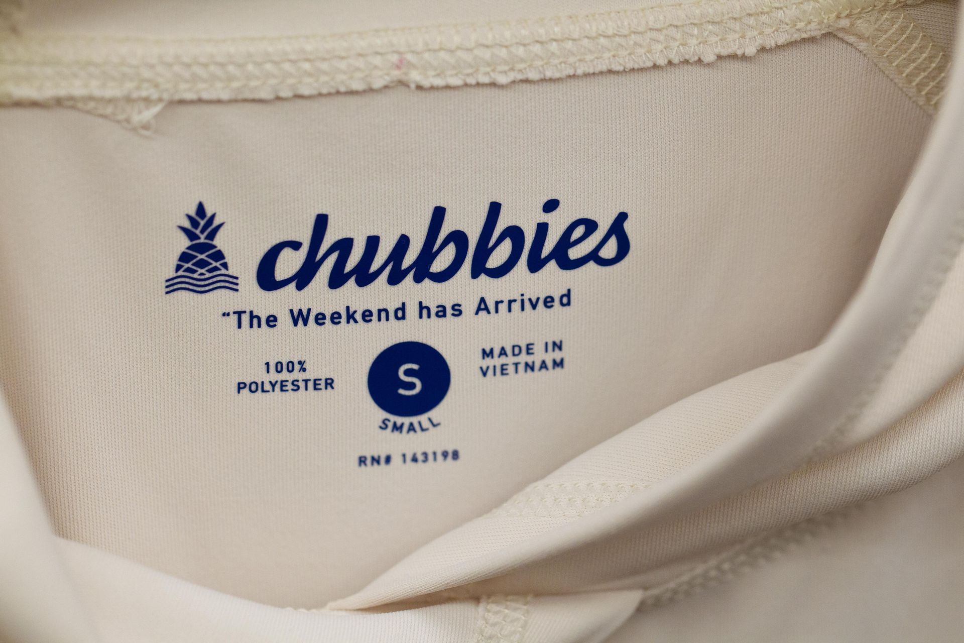 Close-up of a white shirt tag. It has the 