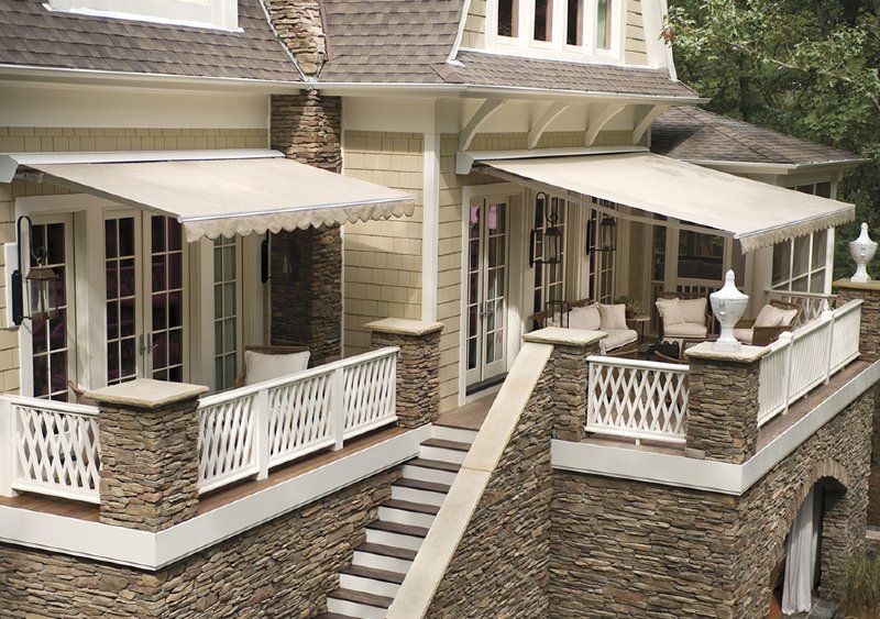 A large house with a large porch and stairs