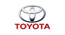 Toyota logo: Silver emblem over red word 