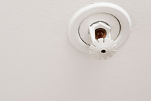 A residential fire sprinkler in a ceiling