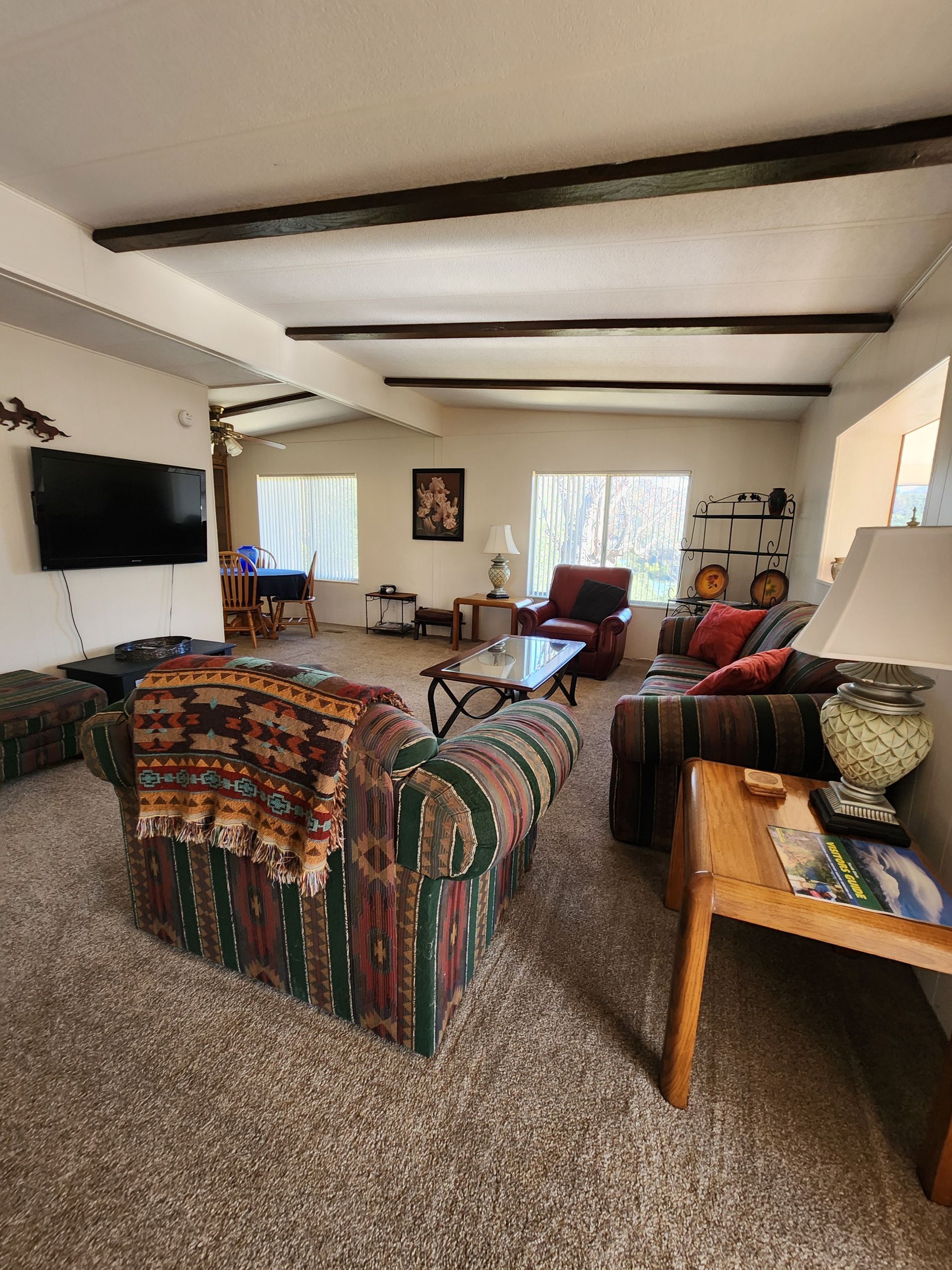 A living room filled with furniture and a flat screen tv.