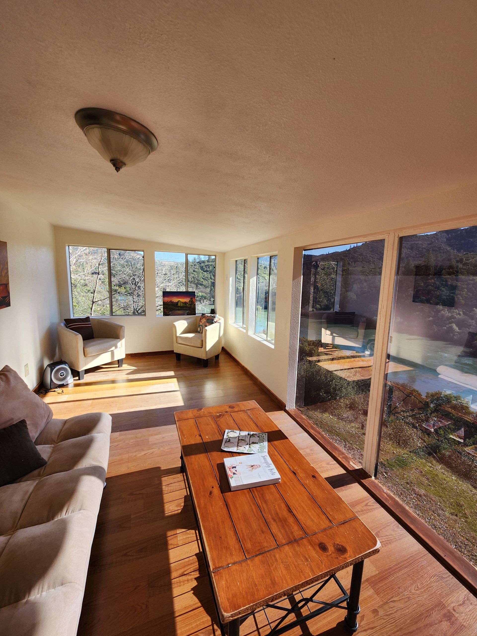 A sunroom with a couch and a coffee table