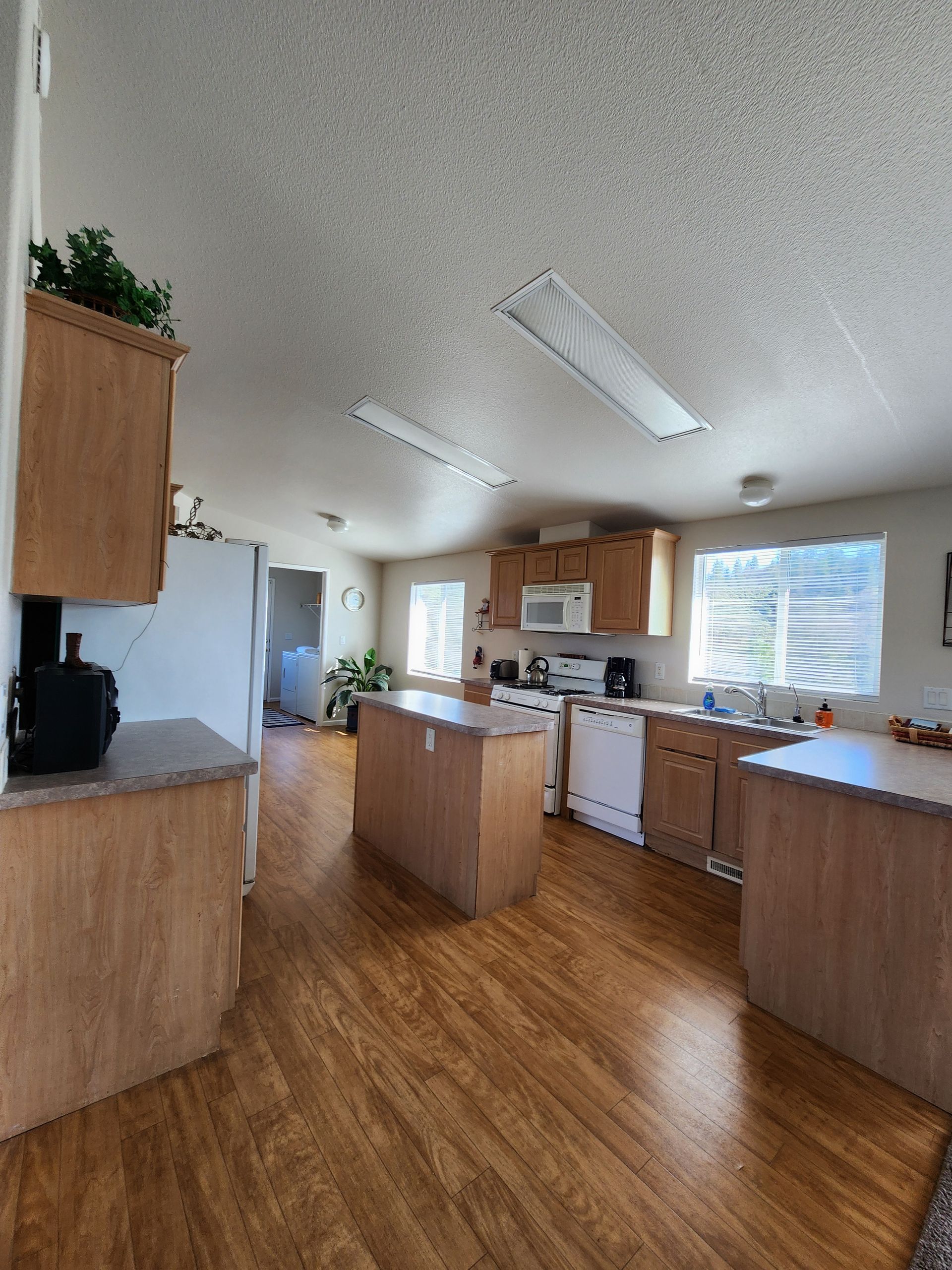 A kitchen with a large island in the middle of it