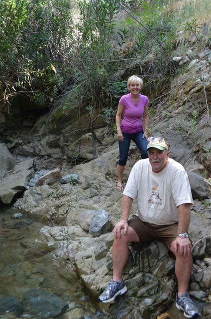 People sitting beside the river