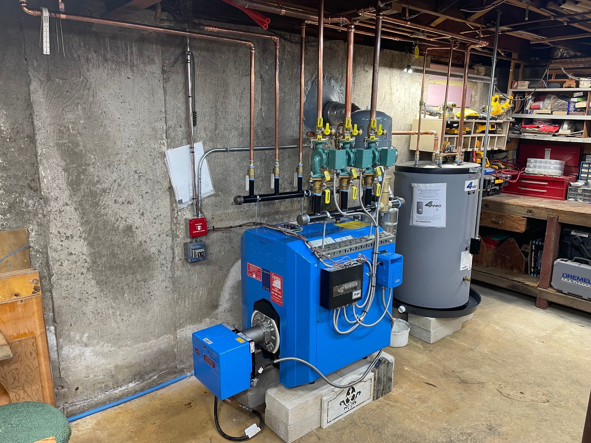 A blue boiler in a basement