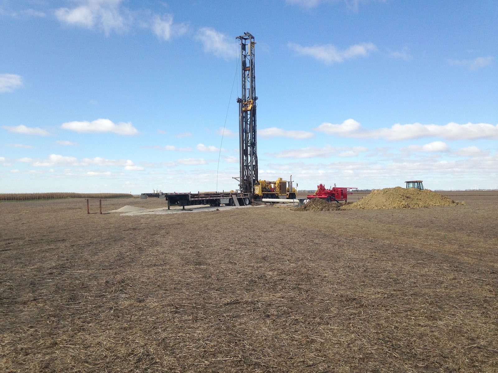 Drilling rig and equipment on a barren field