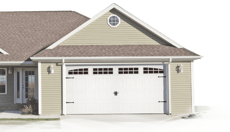 Suburban house front with white double garage door and beige siding, covered by snow